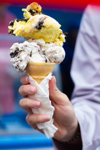 Hershey's Banana PB Moose Tracks and a scoop of Original Moose Tracks on a cone