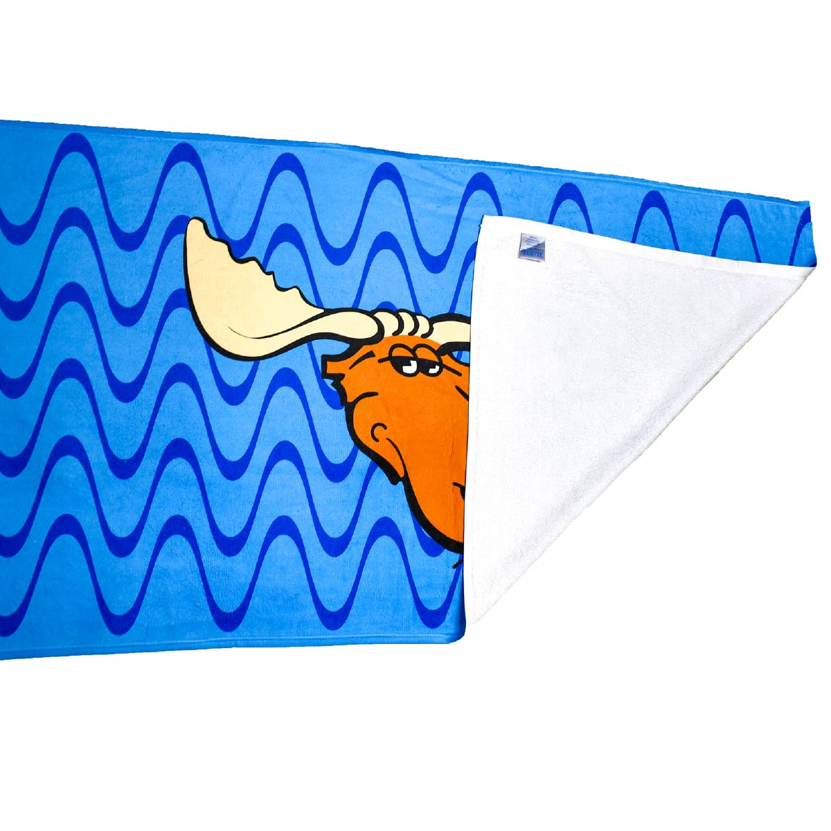 The Moose Tracks Beach Towel laying a flat surface with the bottom right corner flipped over, revealing a white terry cloth underside and a sewn-in product tag. The front of the towel is bright blue with dark and light blue wavy lines in the background and features the Moose Tracks logo in the center.